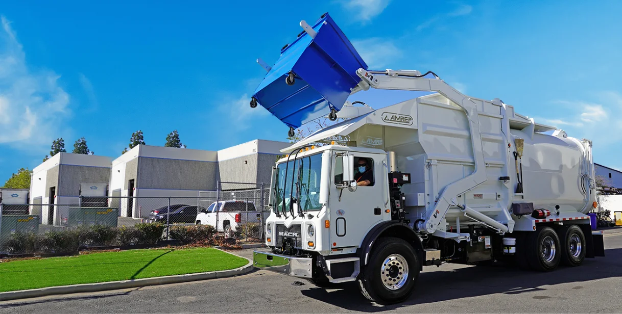 Dizpoz roll-off dumpster and waste management truck at apartment complex